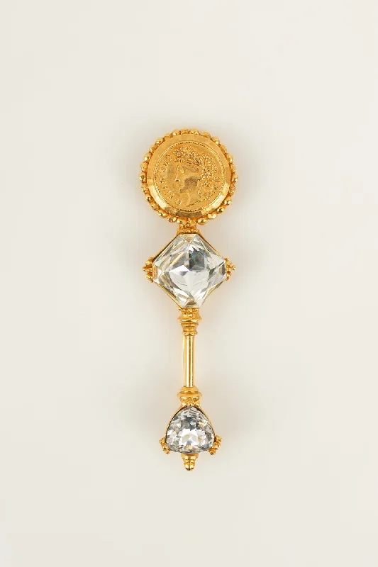 Broche dorée Dior